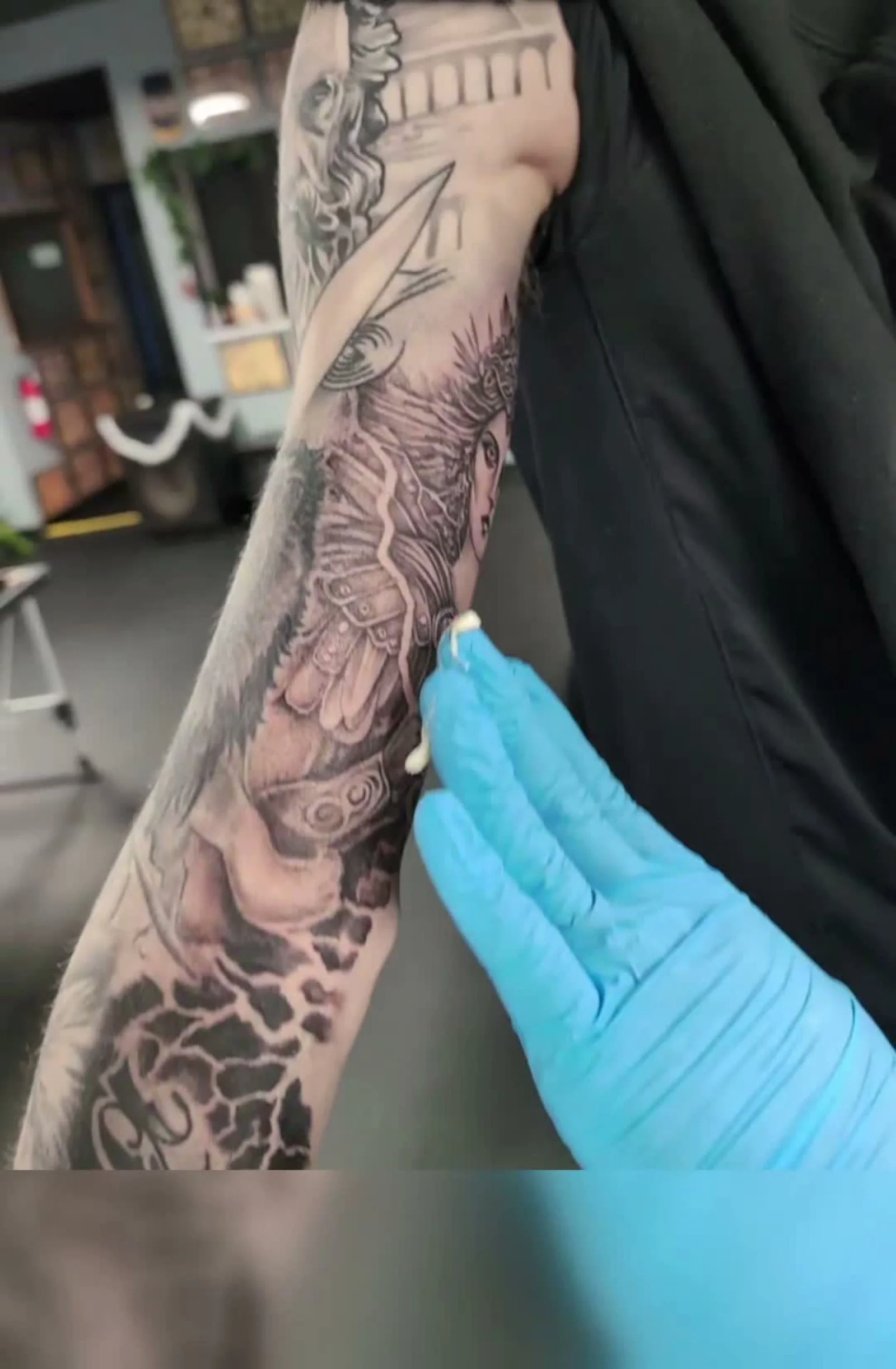Mike Mavretic applying Tattoo Luv during a tattoo session